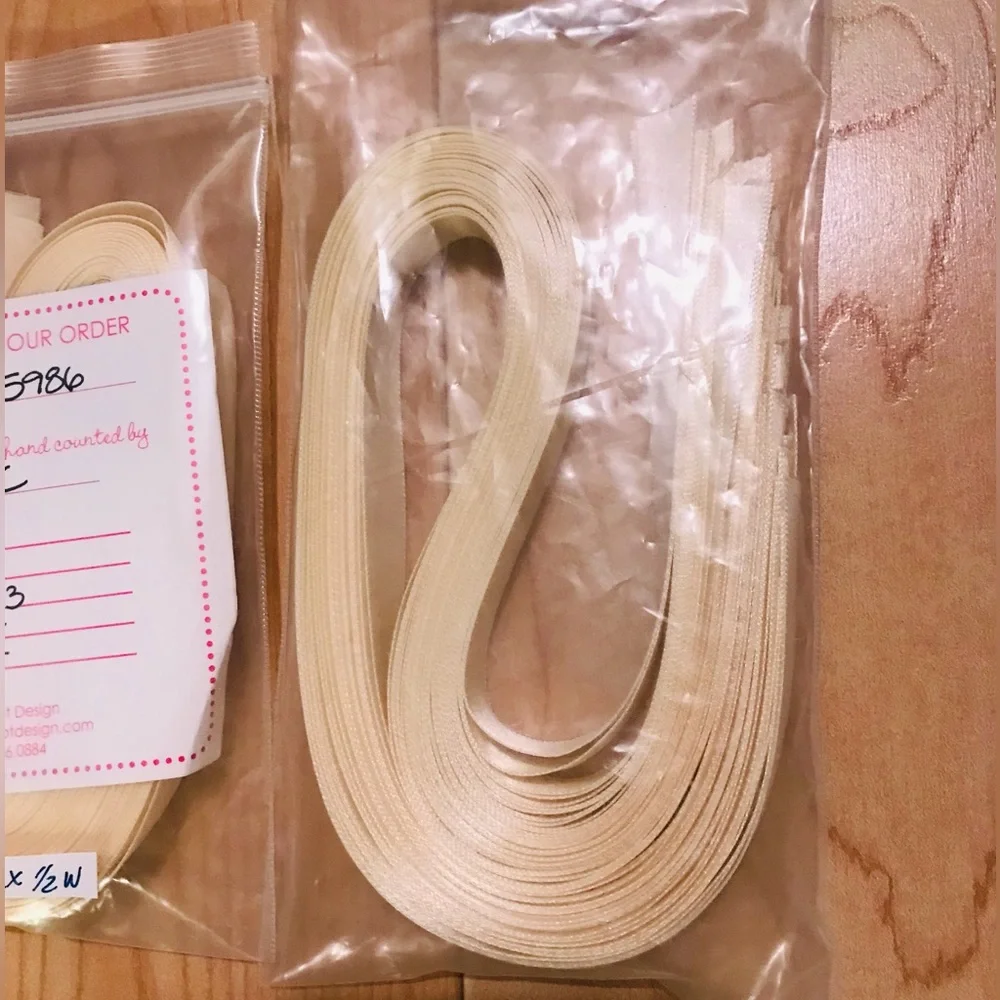 68 pieces of cream colored precut ribbon